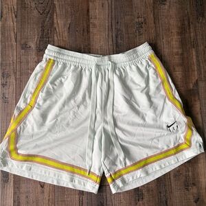 Women’s Nike Fly shorts. Light teal color with yellow and tan stripes